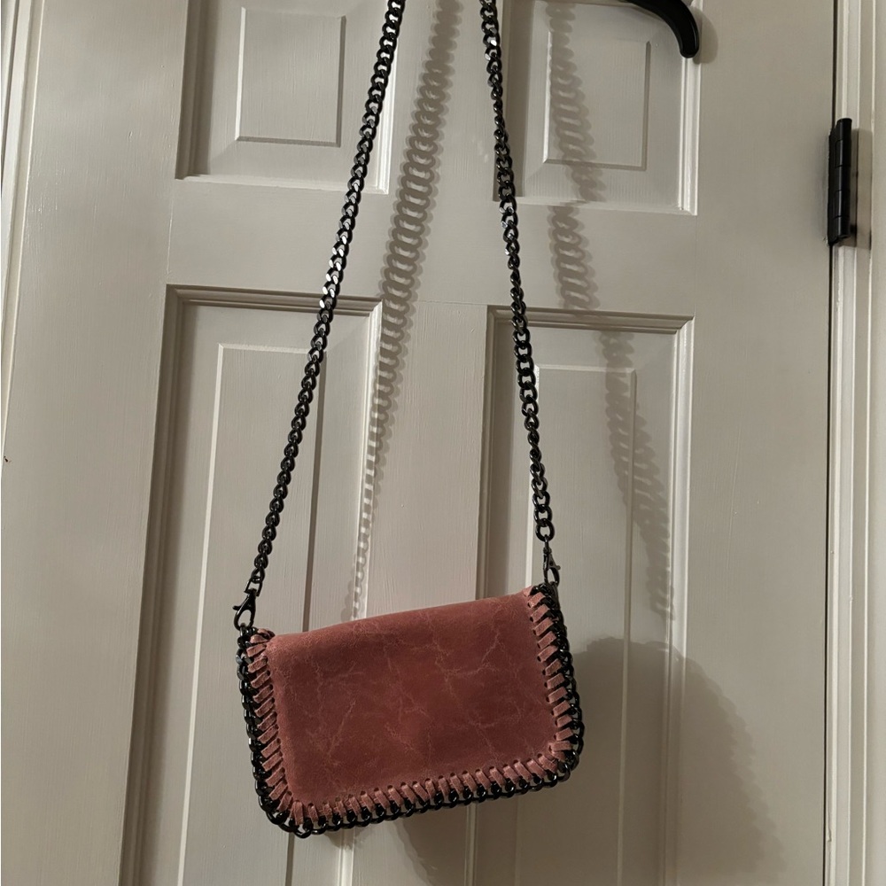 Genuine, leather, Crossbody or clutch leather handbag and a pinkish/mauve color
